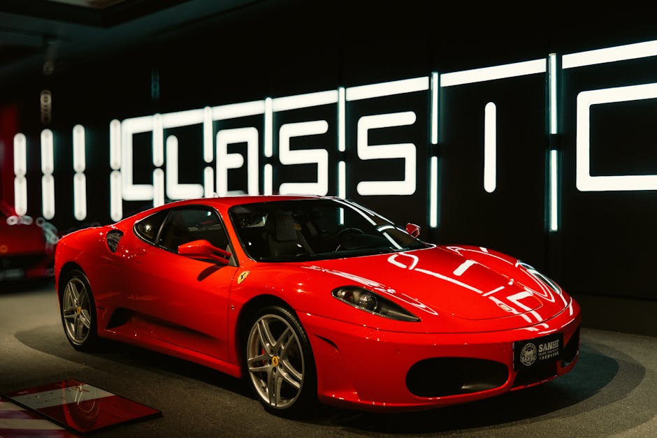 Vibrant red sports car displayed in a modern and stylish showroom with classic design.